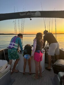 family fishing sunset