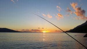 fishing on lake texoma with a rod near body of water during sunset